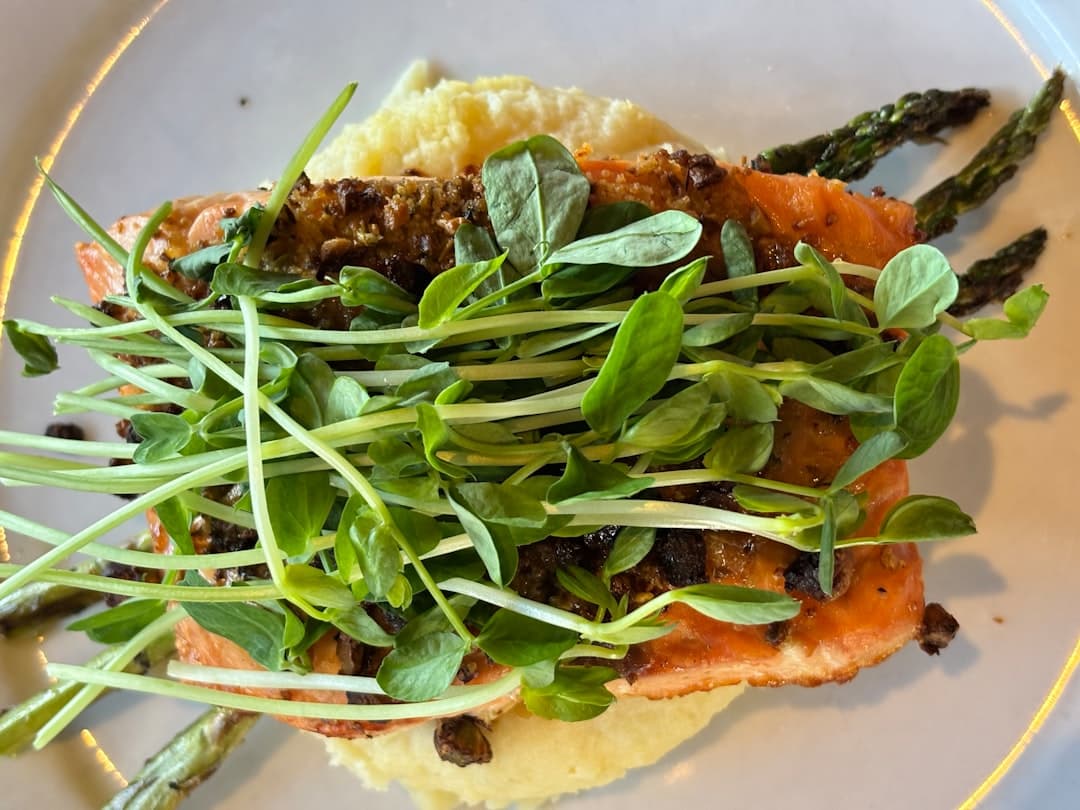 A plate of food with asparagus and other vegetables